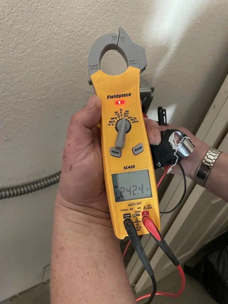 Voltage testing with clamp meter during Ceiling Fan Installation in East Fallowfield